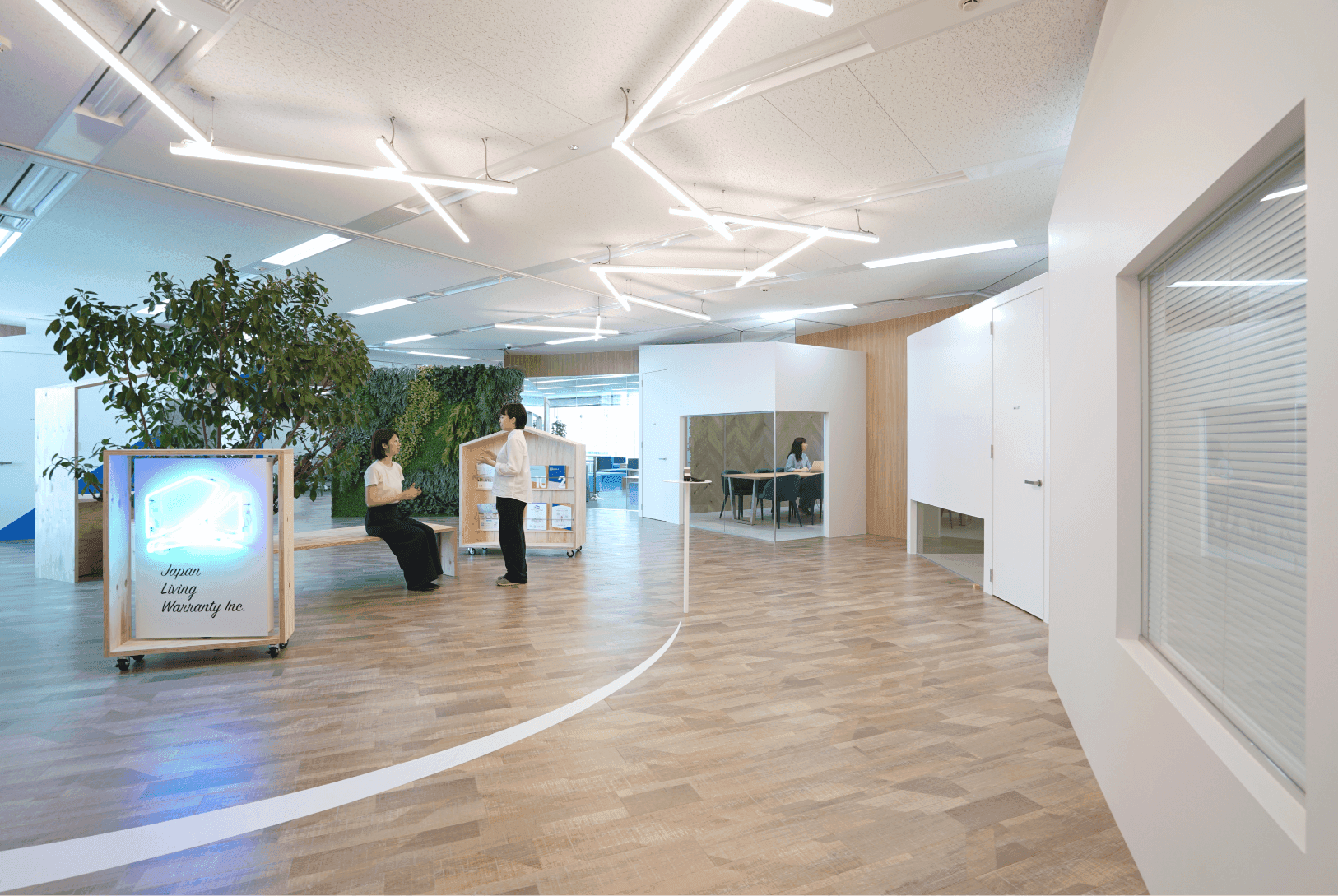 さまざまな「おうち」が建ち並び、公園の緑が豊かにつながるオフィスデザイン